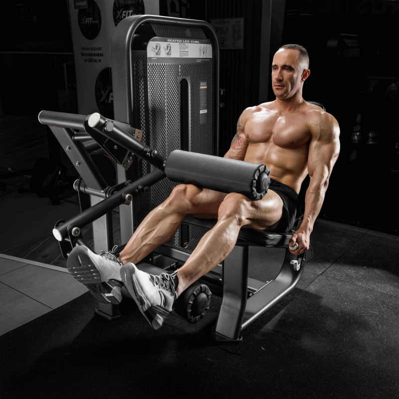 Сгибание ног сидя. Стек E7023 110 кг DHZ Fitness